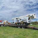 Achiever TC-55 Tracked Aerial with Jib transport on a 15 ton trailer